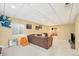 Large finished basement with a sofa, window, and painted accent wall at 23453 Painted Hills St, Parker, CO 80138
