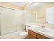 Bright bathroom with a shower over tub, vanity, and ample counter space at 23453 Painted Hills St, Parker, CO 80138