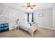 Neutral bedroom with a ceiling fan and two windows at 23453 Painted Hills St, Parker, CO 80138