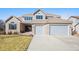 Charming two-story home with attached two car garage and manicured front lawn at 23453 Painted Hills St, Parker, CO 80138