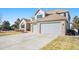 Charming two-story home featuring an attached two car garage and long driveway at 23453 Painted Hills St, Parker, CO 80138