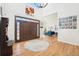 Grand foyer featuring hardwood floors, high ceilings, and a view into the spacious living area at 23453 Painted Hills St, Parker, CO 80138