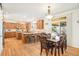 Spacious kitchen featuring hardwood floors, granite counters, breakfast bar and stainless steel appliances at 23453 Painted Hills St, Parker, CO 80138