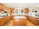 Beautiful kitchen featuring hardwood floors, stainless steel appliances, and a center island at 23453 Painted Hills St, Parker, CO 80138