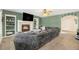 Inviting living room featuring a fireplace, built-in shelving, and a plush sectional sofa, perfect for Gathering gatherings at 23453 Painted Hills St, Parker, CO 80138