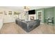Comfortable living room with built-in bookshelves, fireplace, and a large sectional sofa for relaxation at 23453 Painted Hills St, Parker, CO 80138
