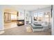 Comfortable sitting room includes a fireplace, seating area, plush carpet, and views into the main bath at 23453 Painted Hills St, Parker, CO 80138