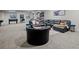 Finished basement featuring a large leather sectional, gaming tables and recessed lighting at 9487 Winding Hill Way, Lone Tree, CO 80124
