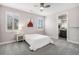 Cozy bedroom features plush carpet, a ceiling fan, and two windows with bright natural light at 9487 Winding Hill Way, Lone Tree, CO 80124