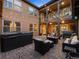 Outdoor living space with a hot tub, fire pit, grill, and seating, perfect for relaxing and entertaining guests at 9487 Winding Hill Way, Lone Tree, CO 80124