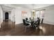 Spacious dining area features modern decor and dark hardwood flooring at 9487 Winding Hill Way, Lone Tree, CO 80124