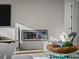 Contemporary linear fireplace is a focal point in the home's modern design at 9487 Winding Hill Way, Lone Tree, CO 80124