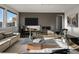 Modern living room boasts a sleek fireplace and contemporary furnishings at 9487 Winding Hill Way, Lone Tree, CO 80124