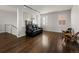 Comfortable living room with hardwood floors, modern lighting, and stylish furniture at 9487 Winding Hill Way, Lone Tree, CO 80124