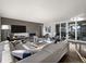 Bright, open living space features a linear fireplace and sliding doors at 9487 Winding Hill Way, Lone Tree, CO 80124