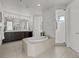 Relaxing main bathroom with a soaking tub, dual vanity, and tiled shower at 9487 Winding Hill Way, Lone Tree, CO 80124