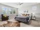Spacious main bedroom with ceiling fan, neutral palette, and an abundance of natural light at 9487 Winding Hill Way, Lone Tree, CO 80124