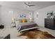 Bright main bedroom features a ceiling fan and stylish decor at 9487 Winding Hill Way, Lone Tree, CO 80124