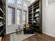 Cozy reading nook with a large bookshelf and ample natural light at 9487 Winding Hill Way, Lone Tree, CO 80124