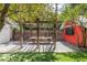 Backyard featuring a covered dining area, turf, and gravel landscaping at 650 Saint Paul St, Denver, CO 80206