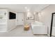 Finished basement with a comfortable seating area and built-in bookshelves at 650 Saint Paul St, Denver, CO 80206