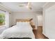 Bright bedroom with a unique wooden headboard, hardwood floors and modern ceiling fan at 650 Saint Paul St, Denver, CO 80206
