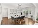 Bright dining room with hardwood floors, large table, and decorative built-in cabinet at 650 Saint Paul St, Denver, CO 80206