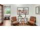 Stylish entryway with decorative art, seating and wood accents, and lots of natural light at 650 Saint Paul St, Denver, CO 80206