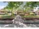 Inviting home featuring a stone retaining wall and steps leading to a well-maintained lawn at 650 Saint Paul St, Denver, CO 80206