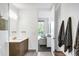 Modern bathroom with floating vanity, stylish fixtures, and an open doorway at 4200 W 17Th Ave # 53, Denver, CO 80204