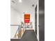Hallway with modern railings and access to carpeted rooms, showcasing unique decor at 4200 W 17Th Ave # 53, Denver, CO 80204