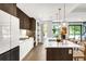 Bright, modern kitchen with a large island, stainless steel appliances, and stylish pendant lighting at 4200 W 17Th Ave # 53, Denver, CO 80204