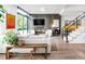 Open-concept living room with modern fireplace, comfortable seating, and hardwood floors at 4200 W 17Th Ave # 53, Denver, CO 80204