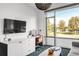 Office area with large windows, desk, and stylish office chair at 4200 W 17Th Ave # 53, Denver, CO 80204