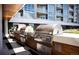 Outdoor kitchen featuring built-in grills and sleek design, perfect for entertaining at 4200 W 17Th Ave # 53, Denver, CO 80204