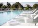 Relaxing poolside view with lounge chairs, towels, and drinkware overlooking the pool at 4200 W 17Th Ave # 53, Denver, CO 80204