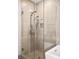 Modern shower with glass door, rain shower head, and built-in niche at 4200 W 17Th Ave # 53, Denver, CO 80204