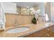 Elegant bathroom with double vanity, granite countertops, and modern fixtures at 410 Acoma St # 309, Denver, CO 80204