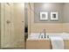 Bright bathroom with a separate shower, soaking tub, and stylish tile work at 410 Acoma St # 309, Denver, CO 80204