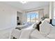 Bright bedroom featuring a large window with natural light, soft carpet, and a comfortable bed at 410 Acoma St # 309, Denver, CO 80204