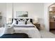 Comfortable bedroom features soft decor, a modern bed frame, and natural light at 410 Acoma St # 309, Denver, CO 80204