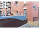 Watermark condos with a brick facade and balconies provide modern city living at 410 Acoma St # 309, Denver, CO 80204