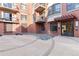 Courtyard entrance with brick facade and patterned tile at 410 Acoma St # 309, Denver, CO 80204