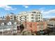 View of multi-story apartment building showcasing balconies and architectural details at 410 Acoma St # 309, Denver, CO 80204