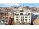 A stunning view showcasing the multi-story residential building and skyline at 410 Acoma St # 309, Denver, CO 80204