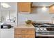 Stylish kitchen with granite countertops, stainless steel appliances and view of the bedroom at 410 Acoma St # 309, Denver, CO 80204