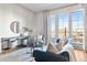 Bright living room with large windows, modern furnishings, and hardwood floors at 410 Acoma St # 309, Denver, CO 80204