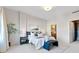 Comfortable main bedroom with a queen bed, accent bench, and an ensuite bathroom at 410 Acoma St # 309, Denver, CO 80204