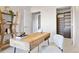 Bright office with wood desk, stylish chair, and view of the walk-in closet at 410 Acoma St # 309, Denver, CO 80204
