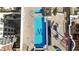 Overhead view of an M-shaped pool with stylish tables and chairs on a rooftop terrace at 410 Acoma St # 309, Denver, CO 80204